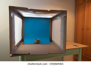 Home Photo Set With Crafted Light Tent Of A Tea Cup On A Plain Color Background And Led Stripe Lights