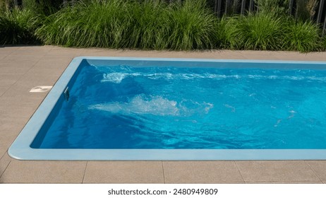 In the home pool, the counter-current system is turned on, making it an excellent place to swim in the backyard