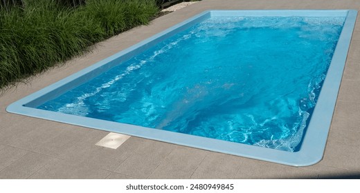In the home pool, the counter-current system is turned on, making it an excellent place to swim in the backyard