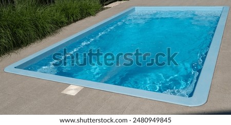 In the home pool, the counter-current system is turned on, making it an excellent place to swim in the backyard