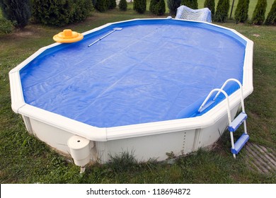 Home Pool Covered With Solar Cover.