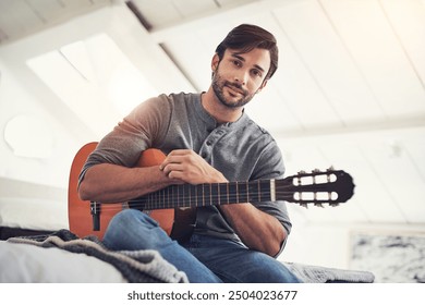 Home, portrait and man with smile for guitar, playing music and talent with creative skills for performance. House, male person or musician with acoustic instrument for audio, practice and guitarist - Powered by Shutterstock