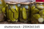 Home preservation in glass jars. Cucumbers in glass jars