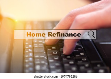 Home Refinancing Concept. A Man Is Researching A Topic On The Internet Of Home Refinancing