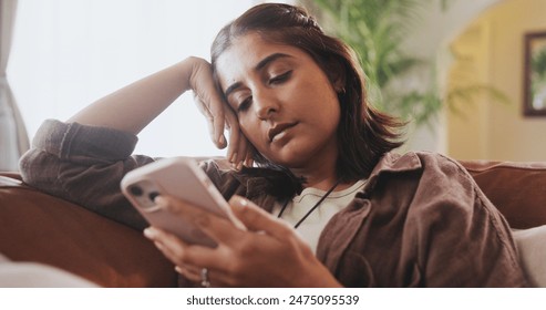 Home, relax and woman on couch, smartphone and typing with connection, social media or doom scrolling. Person, apartment or girl on sofa, cellphone or addiction with bad habit, network or digital app