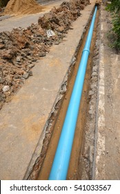 Home renovation, plumber fixing sewerage pipe at construction site