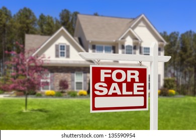 Home For Sale Real Estate Sign and Beautiful New House. - Shutterstock ID 135590954