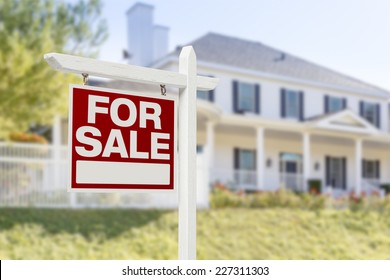 Home For Sale Real Estate Sign in Front of Beautiful New House. - Shutterstock ID 227311303