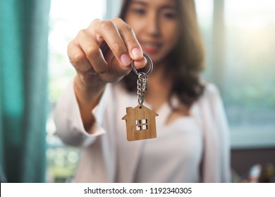 Home Sales Agents Are Giving Home Keys. Rent A House, Buy And Sell Concept