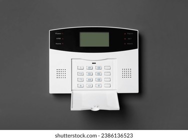 Home security alarm system on gray wall
