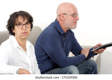 At Home, Senior Man Watching Tv And Bored Woman