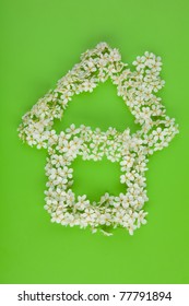 Home Sign Made Of White Spring Cherry Tree Flowers On Green Background