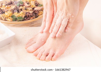 Home SPA. Young Woman Doing Foot Peeling, Scrub Using Natural Cosmetics.