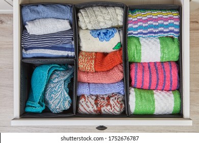 Home Storage System For Linen, Clothes And Fabrics. The Drawer Of The Cabinet Is Divided Into Compartments Using Boxes Of Different Sizes.Organizer For Underwear And Towels.