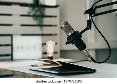 Home Studio Podcast Interior. Microphone, Laptop And On Air Lamp On The Table