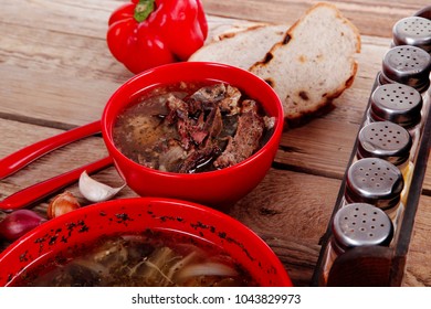 Home Style Beef Meat Soup Vintage Country Wood Table Asparagus Pepper Bell Spices Bread Garlic Cutlery Spices Red Bowls