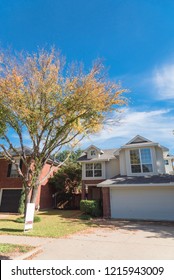 Home In Suburban Dallas-Fort Worth With Empty House For Sale By Owner Yard Sign. Colorful Autumn Fall Foliage In Texas, North America.