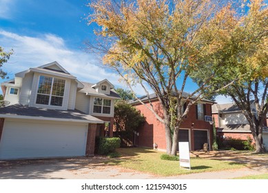 Home In Suburban Dallas-Fort Worth With Empty House For Sale By Owner Yard Sign. Colorful Autumn Fall Foliage In Texas, North America.