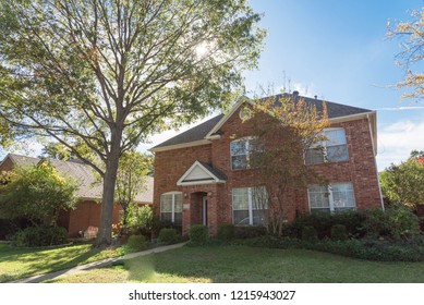 Home In Suburban Dallas-Fort Worth With Empty House For Sale By Owner Yard Sign. Colorful Autumn Fall Foliage In Texas, North America.