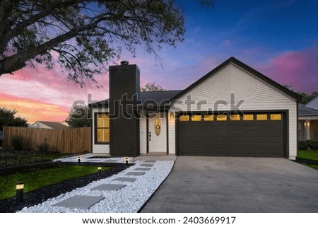 a home at sunset with a green yard