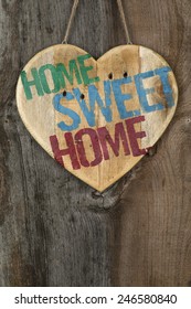 'Home Sweet Home' Message Wooden Heart Sign From Recycled Old Palette On Rough Grey Wooden Background, Copy Space