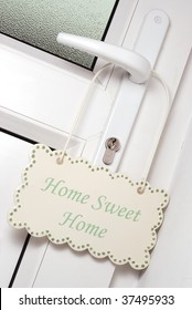 Home Sweet Home Sign Hanging On A Door Handle