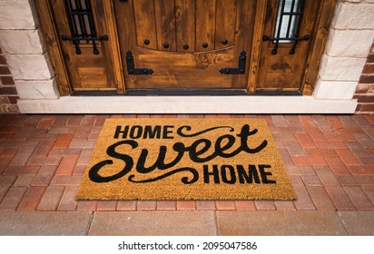 Home Sweet Home Welcome Mat At Custom Front Door Of House.