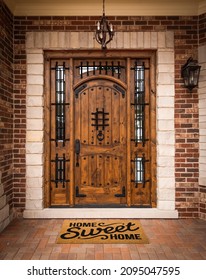 Home Sweet Home Welcome Mat At Custom Front Door Of House.