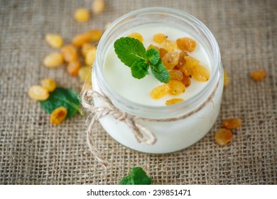 Home Sweet Yogurt With Raisins In A Glass Jar