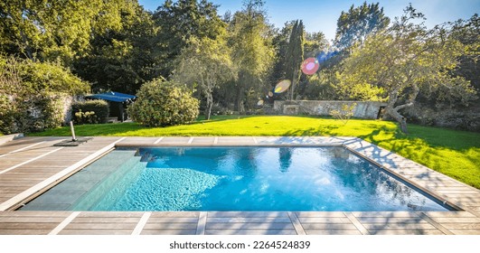 home swimming pool in garden and terrace - Powered by Shutterstock