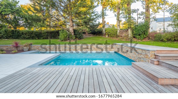 home swimming pool in\
garden and terrace