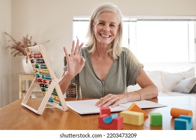 Home Teacher In Video Call Teaching Elearning Education, Knowledge And Math Development Training With Notebook And Hello. Senior Woman In A Zoom Call Class Or Online Assessment With POV Portrait