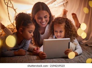 Home Tent Mother And Kids On Tablet Watch Movie Or Online Children Entertainment Movies At Night At House. Happy Smile Mom Or Woman And Young Girl Youth Family Watching Or Playing Fun Internet Games