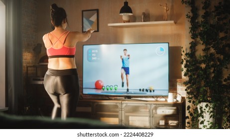 Home Training: Magnificent Plus Size Body Positive Girl Training With Personal Trainer Via Online Video Tutorial. Authentic Woman Using Workout Service Fitness Streaming App For Virtual Training