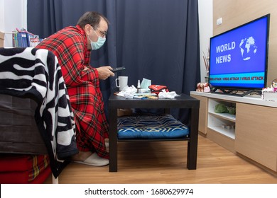 Home Treatment In Isolated Quarantine - Stay Safety Home. The Sick Man With Remote Control In Hand Watching TV News About Global Virus Attack. 