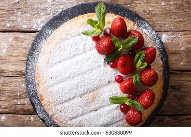 Home Victoria Sponge Cake, Decorated With Strawberries, Cranberries And Mint Closeup On The Table. Horizontal View From Above
