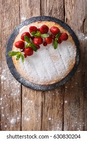 Home Victoria Sponge Cake, Decorated With Strawberries, Cranberries And Mint Closeup On The Table. Vertical View From Above
