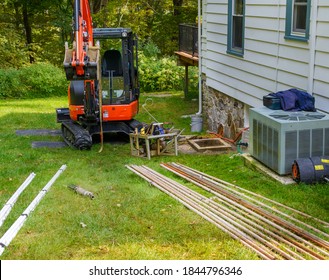 Home Water Well Pump Replacement Job With Old Pipes And Pump And New Pipes With Tools Needed For Job