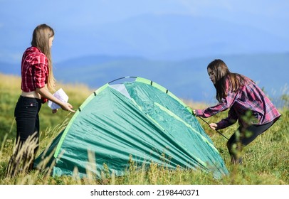 Home Is Where The Tent Is. Two Girls Pitch Tent. Wanderlust Discovery. Friends Spend Free Time Together. Hiking Outdoor Adventure. Family Camping. Reach Destination Place. Mountain Tourism Camp