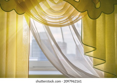 Home window decorated with yellow curtain with frills and white veil hanging on cornice indoor closeup view - Shutterstock ID 2097962161