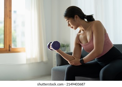 Home Workout Concept Asian Woman In Living Room With Lifting Dumbells Mental Health In Quarantine