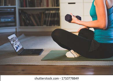 Home Workout Concept Woman In Living Room With  Laptop And Dumbells Mental Health In Quarantine