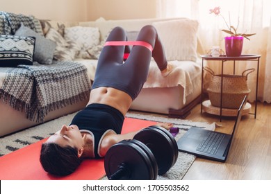 Home Workout During Coronavirus Quarantine. Booty Glutes Building. Glutes Bridge. Woman Training Using Mat Sport Belt.