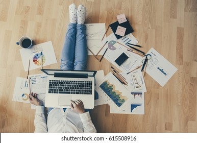 Home workplace concept - girl working with reports and having a coffee. - Shutterstock ID 615508916
