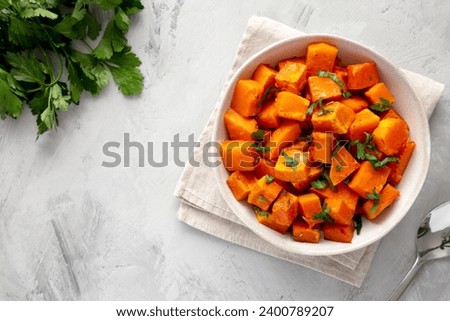 Home-baked Butternut Squash with Herbs and Spices, top view. Space for text.