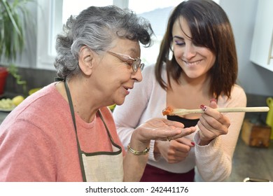 Homecare Cooking Dinner For Elderly Woman