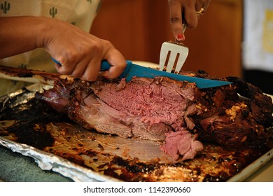 Home-cooked Lamb Getting Sliced Up For Family Dinner