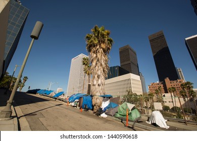 A Homeless Encampment Next To A Downtown Los Angeles Freeway.