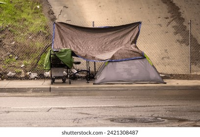 A homeless encampment under a bridge during a rain storm in San Diego County California