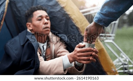 Homeless, hands and person help with money for poverty donation, financial aid or compassion. Tent, beggar and giving coins for empathy, generosity and charity with vulnerability or desperate outdoor